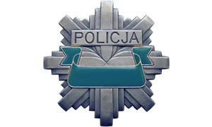 Zdjęcie odznaki policyjnej.